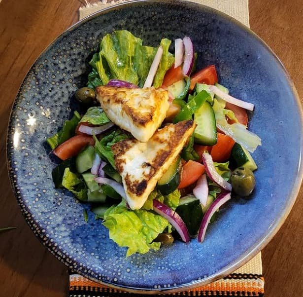 Country Salad with tomatoes, peppers and baked cheese